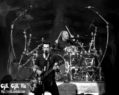 Photo of Tyler Connolly on Vocals and Joey Dandeneau on Drums with Theory of a Deadman performing at the CNE Bandshell. Photo credit ccvic.zenfolio.com