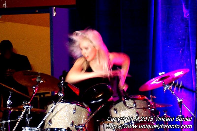 Photo of Renée Couture playing the drums in the band " The StandStills". Photo credit Vincent Banial