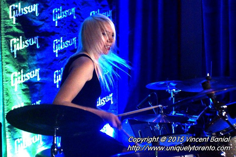 Photo of Renée Couture playing drums in the band "The StandStills". Photo credit Vincent Banial