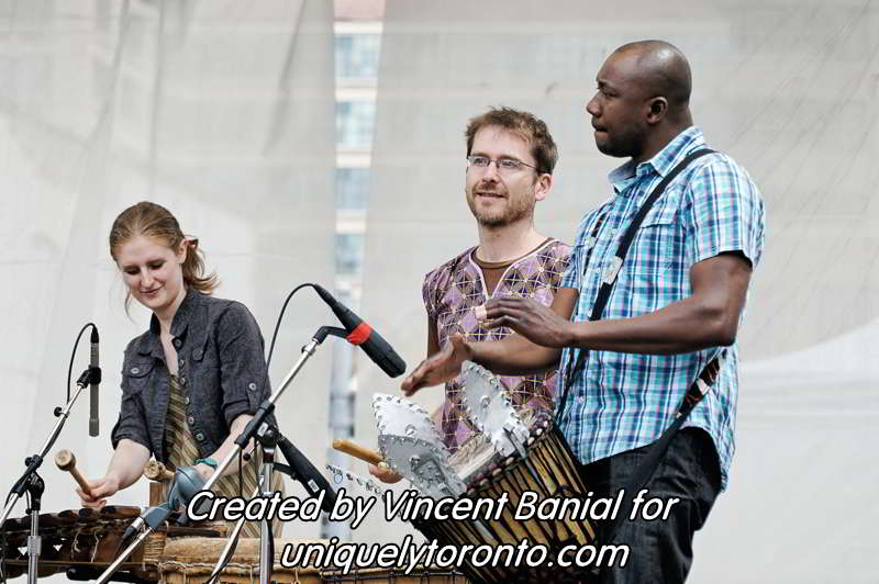 Photo of Katenan Dioubate - CHEKA performing at Yonge Dundas Square in Toronto on May 25 2015. Photo credit Vincent Banial