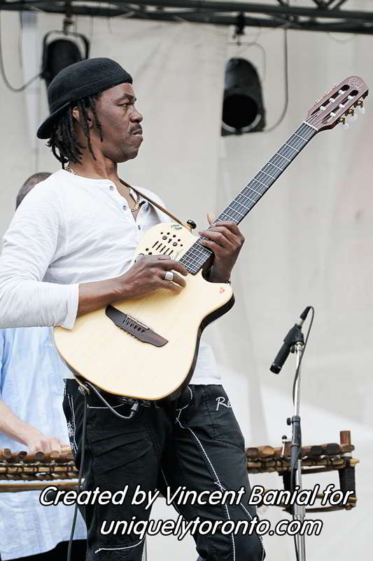 Photo of Katenan Dioubate - CHEKA performing at Yonge Dundas Square in Toronto on May 25 2015. Photo credit Vincent Banial