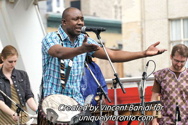 Photo of Katenan Dioubate - CHEKA performing at Yonge Dundas Square in Toronto on May 25 2015. Photo credit Vincent Banial
